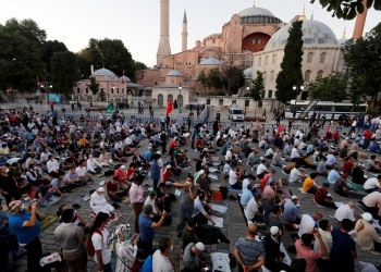 Muslims gather for evening prayers in front of the Hagia Sophia or Ayasofya, after a court decision that paves the way for it to be converted from a museum back into a mosque, in Istanbul, Turkey, July 10, 2020. REUTERS/Murad Sezer