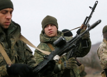FILE PHOTO: Militants of the self-proclaimed Donetsk People's Republic take part in shooting drills at a range on the outskirts of Donetsk, Ukraine, December 14, 2021. REUTERS/Alexander Ermochenko/File Photo