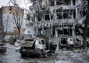 Damaged vehicles sit among debris and in Kharkiv city center in Ukraine, Wednesday, March 16, 2022. (AP Photo/Pavel Dorogoy)