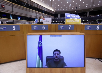 Ukrainian President Volodymyr Zelenskiy addresses the European Parliament special session, from a screen, to debate its response to the Russian invasion of Ukraine, in Brussels, Belgium March 1, 2022. REUTERS/Yves Herman