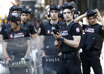 epa06049869 Turkish police stand guard near Taksim Square during the Istanbul LGTB Pride Parade which was cancelled due to security concerns by the governor of Istanbul, in Istanbul, Turkey, 25 June 2017. Transgenders people and supporters try to march in central Istanbul as part of the Trans Pride Week 2017, which is organized by Istanbul's 'Lesbians, Gays, Bisexuals, Transvestites and Transsexuals' (LGBT) solidarity organization.  EPA/SEDAT SUNA