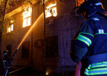 Firefighters extinguish a fire in the university building following a reported shelling in the course of Russia-Ukraine conflict in Donetsk, Russian-controlled Ukraine, August 5, 2023. REUTERS/Alexander Ermochenko