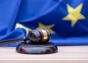 Flag of European Union and judges wooden gavel on the top, concept picture about court and justice